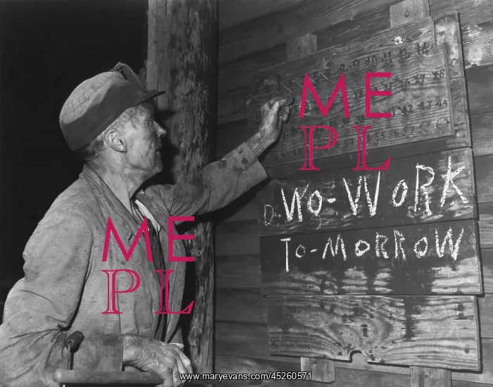 : A coal loader putting up his check at the end : A coal loader putting up his check at the end