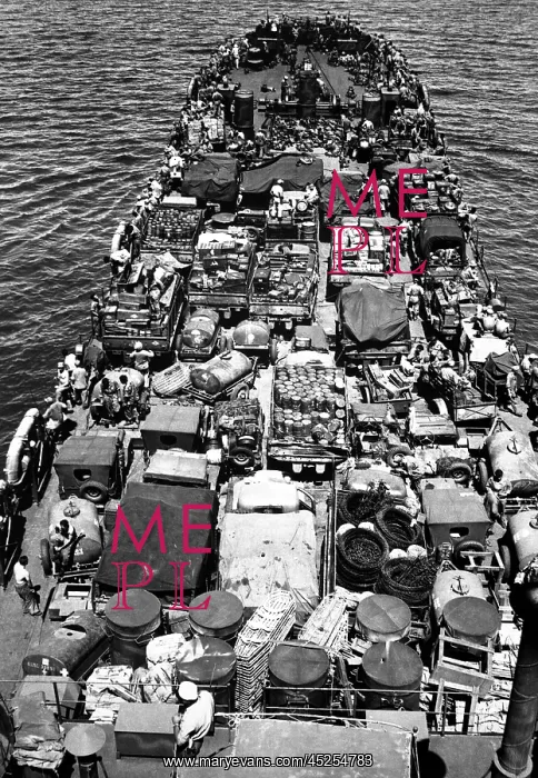 : Coast Guard-manned LST crammed with Marines and : Coast Guard-manned LST crammed with Marines and