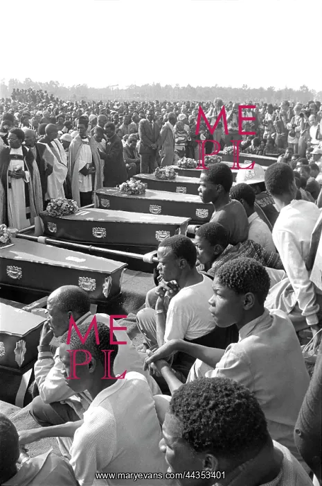 : Coffins lined up at gravesites at a mass funeral held : Coffins lined up at gravesites at a mass funeral held