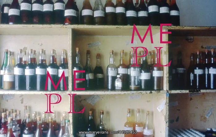 : Colour photo of bottles of muti on shelves inside : Colour photo of bottles of muti on shelves inside
