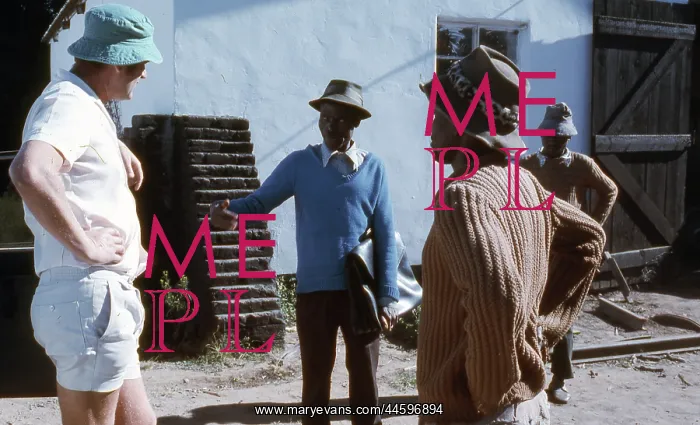 : Colour photo of farmer talking to labourers in : Colour photo of farmer talking to labourers in