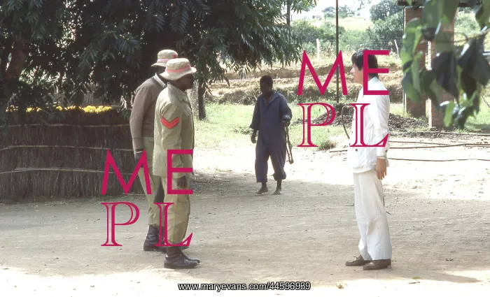 : Colour photo of guards at a protected village; : Colour photo of guards at a protected village;