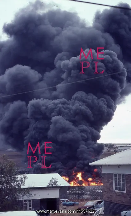  : Colour photo of plume of smoke and flames during