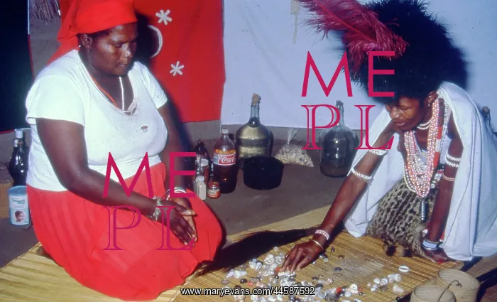 : Colour photo of sangoma throwing the bones for : Colour photo of sangoma throwing the bones for