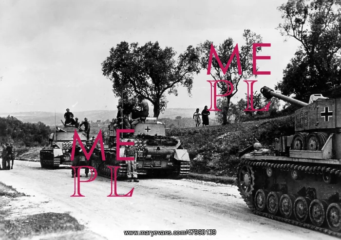 : A column of Panzer IVs stops on a street in southern : A column of Panzer IVs stops on a street in southern