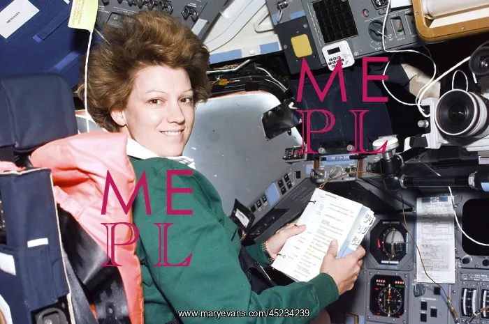 : Commander Eileen Collins consults a checklist ? : Commander Eileen Collins consults a checklist ?