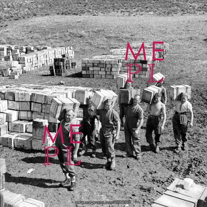 : Compo ration dump and men carrying more supplies : Compo ration dump and men carrying more supplies