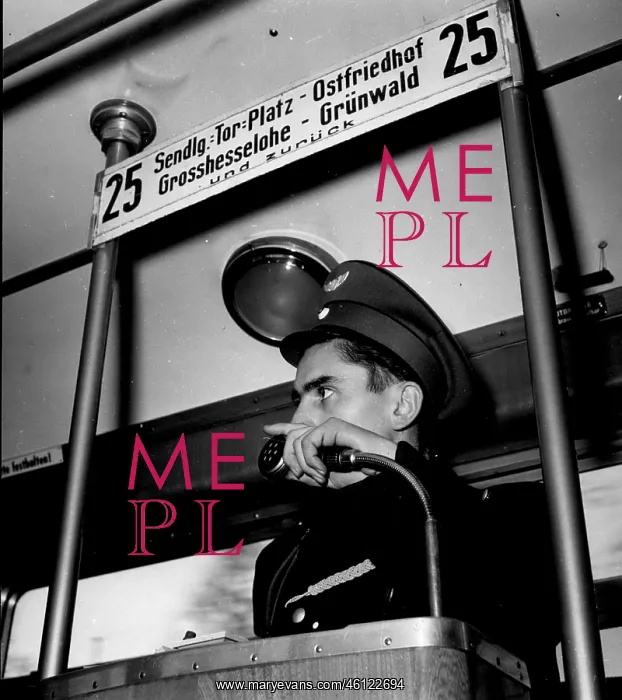 : Conductor using microphone for passenger announcements : Conductor using microphone for passenger announcements