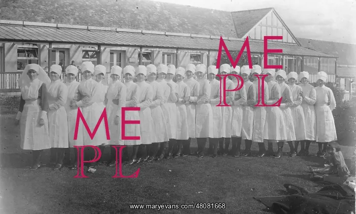 : ?Conga? line of 25 nurses, outside single-storey building : ?Conga? line of 25 nurses, outside single-storey building
