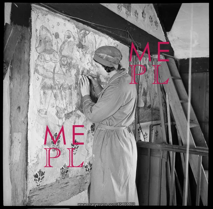 : Conservator restoring a medieval wall painting : Conservator restoring a medieval wall painting