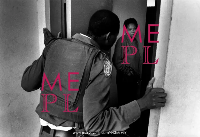 : Constable Sibanyoni tries to get access to a flat in : Constable Sibanyoni tries to get access to a flat in