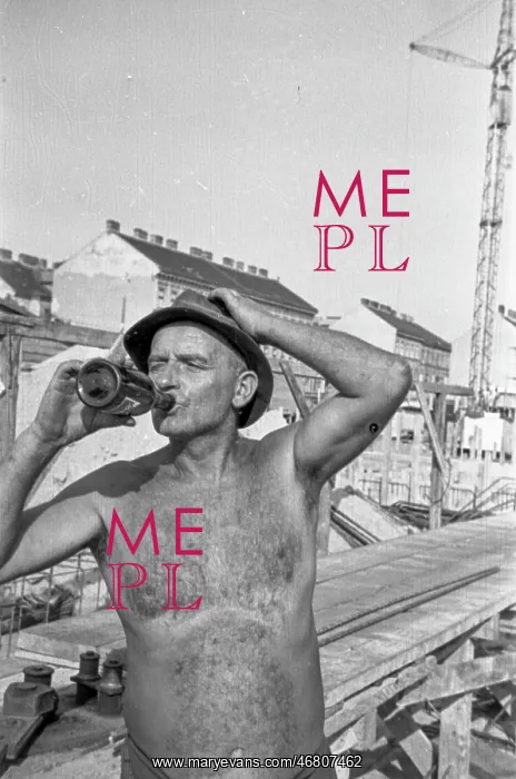 : Construction worker drinks beer : Construction worker drinks beer