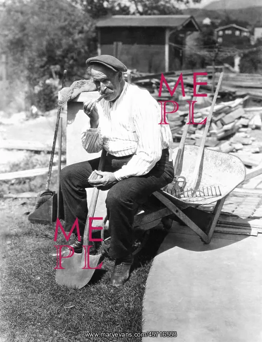  : Construction worker taking a cigar break