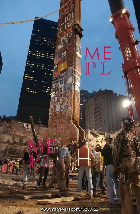 : Construction workers maneuver the last piece of : Construction workers maneuver the last piece of