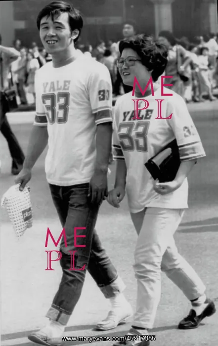 : CONSUMERS-A couple strolls in Tokyo wearing ? : CONSUMERS-A couple strolls in Tokyo wearing ?