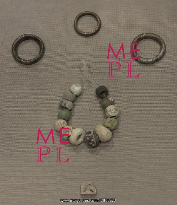 : Copper hair-rings and ring, beads and an amulet : Copper hair-rings and ring, beads and an amulet