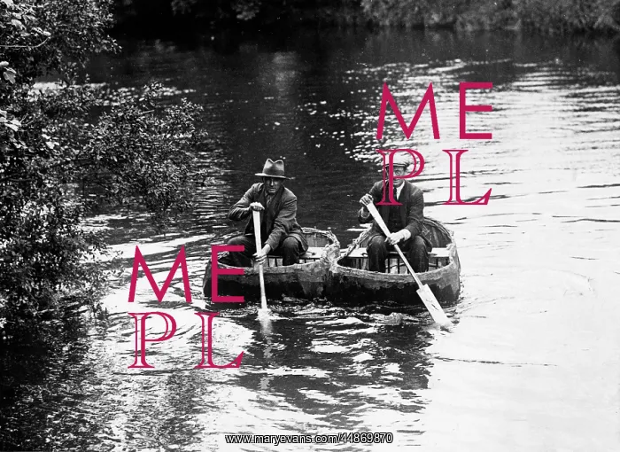  : CORACLES. Two old men, paddling along a river in coracles