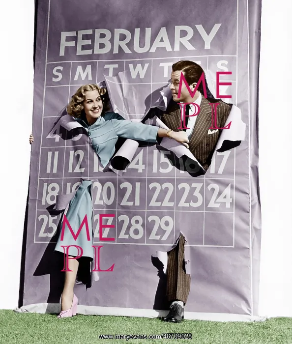 : Couple bursting through leap year calendar : Couple bursting through leap year calendar