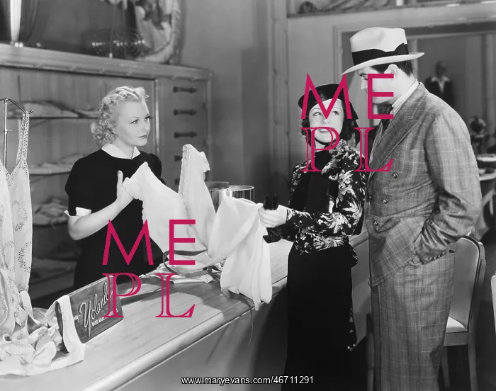 : Couple and clerk in shop : Couple and clerk in shop