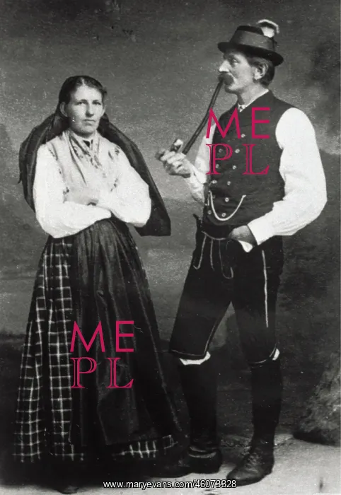  : Couple in costume. She with headscarf. He with