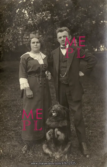 : Couple and dog in a garden : Couple and dog in a garden