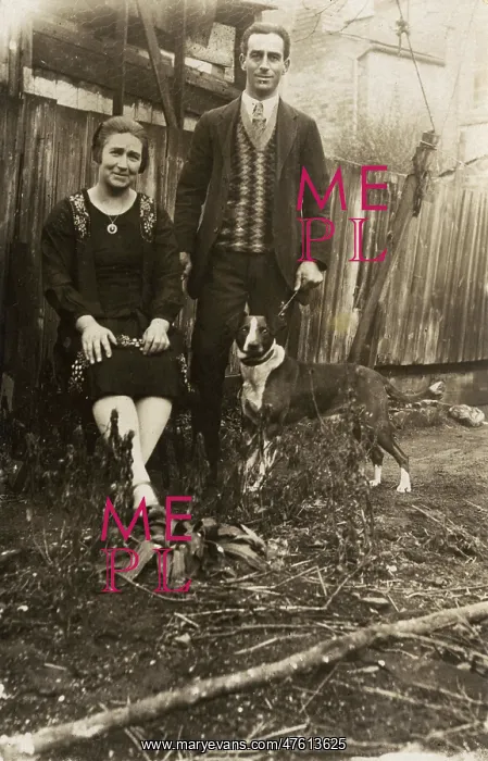  : Couple with a dog in a garden