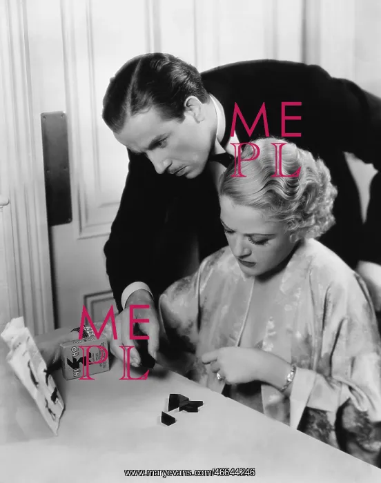 : Couple doing puzzle : Couple doing puzzle