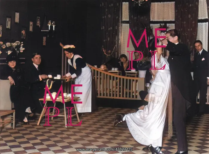 : A couple dressed in their finery, dancing