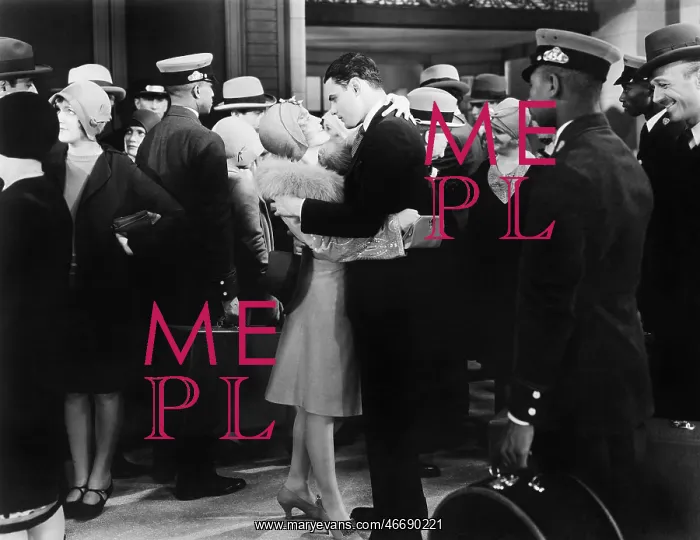 : Couple embracing at a train station : Couple embracing at a train station