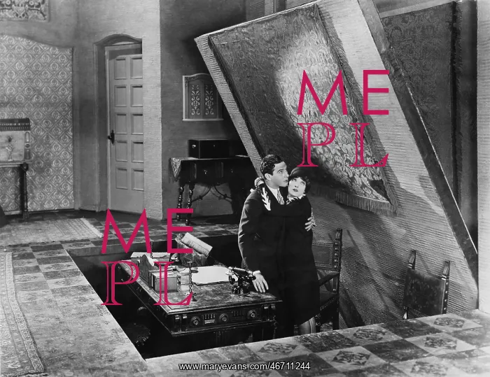 : Couple emerging from hidden room : Couple emerging from hidden room