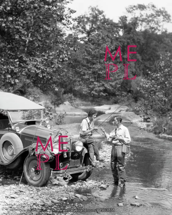 : Couple Fly Fishing in Stream : Couple Fly Fishing in Stream