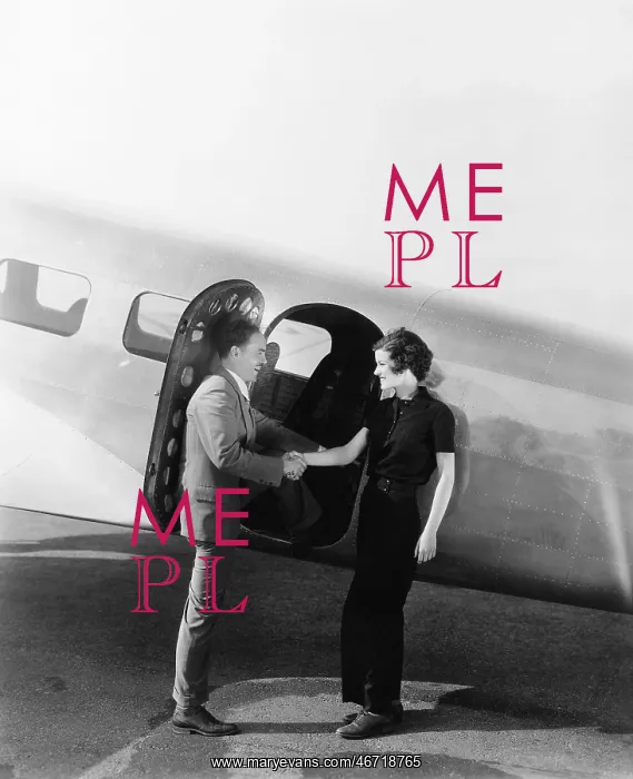 : Couple greeting each other at a small airplane : Couple greeting each other at a small airplane