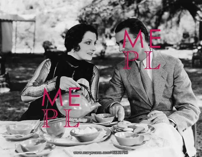 : Couple having tea outdoors : Couple having tea outdoors