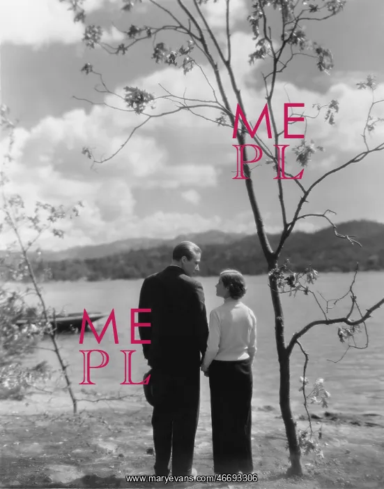 : Couple holding hands beside a lake : Couple holding hands beside a lake