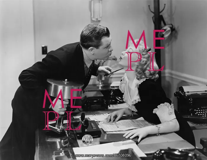 : Couple kissing in the office : Couple kissing in the office