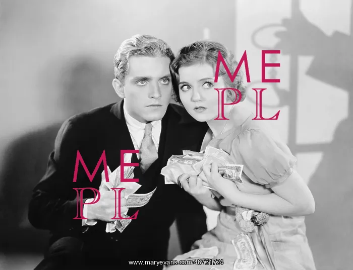 : Couple looking scared with a fistful of money : Couple looking scared with a fistful of money