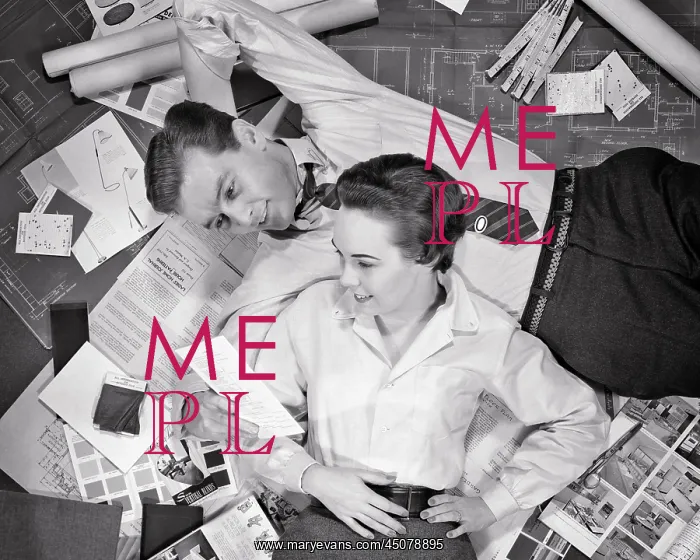 : Couple Lying on Top of Blueprints Samples for New Home : Couple Lying on Top of Blueprints Samples for New Home