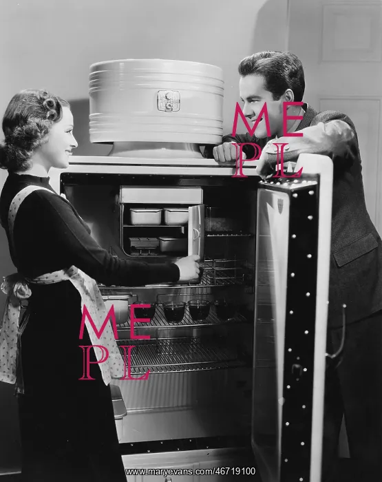  : Couple with open refrigerator