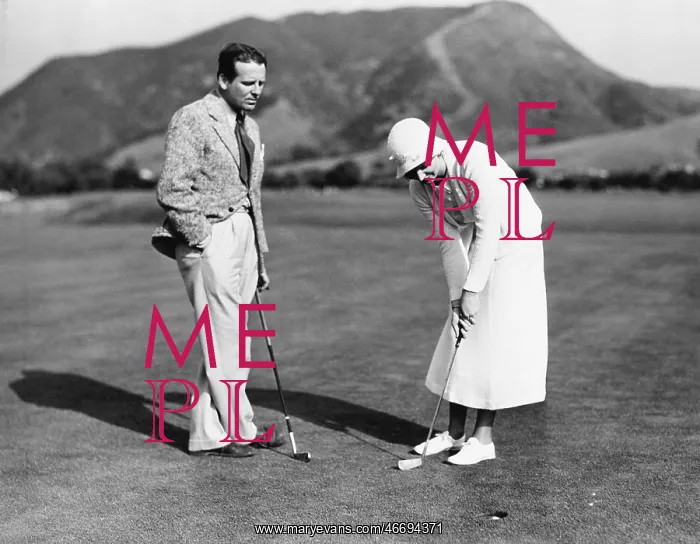  : Couple playing golf together