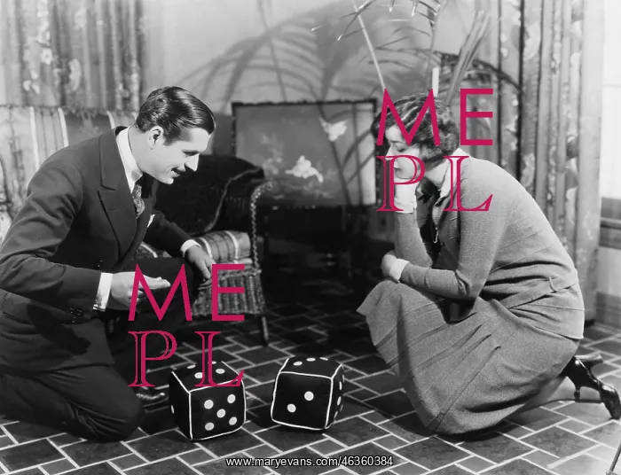  : Couple playing with huge dice
