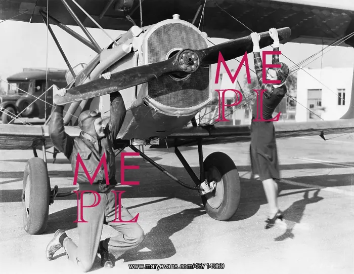 : Couple playing with propeller on plane