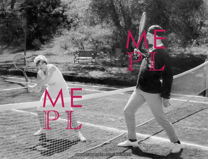 : Couple playing tennis together : Couple playing tennis together