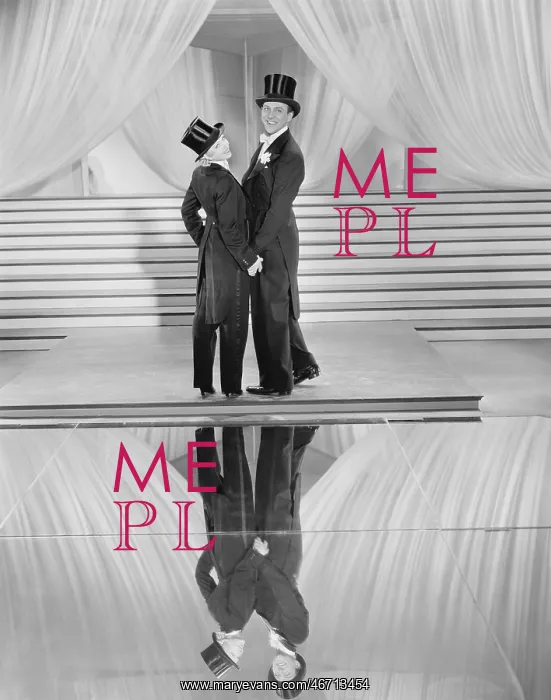 : Couple posing in tuxedos and reflection : Couple posing in tuxedos and reflection
