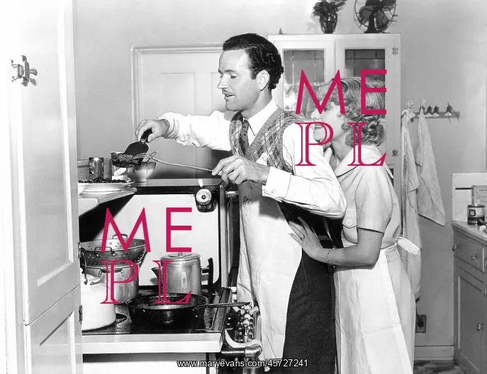 : Couple preparing a meal together : Couple preparing a meal together