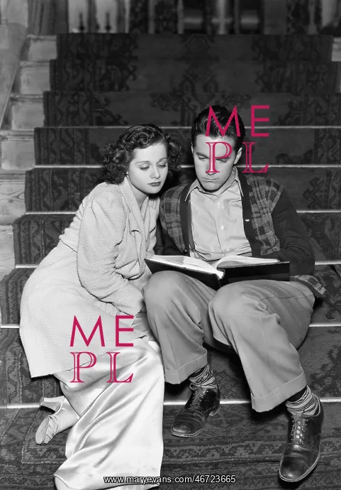 : Couple reading together on stairs : Couple reading together on stairs