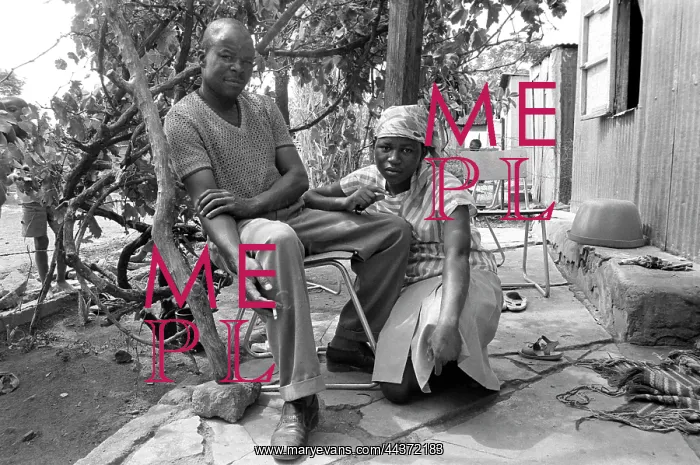 : Couple in the shade of an Oukasie home. The people : Couple in the shade of an Oukasie home. The people
