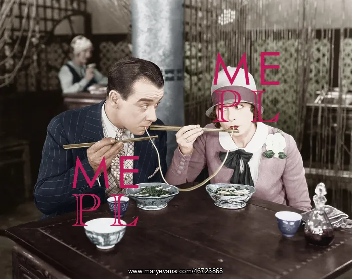: Couple sharing a noodle in a restaurant : Couple sharing a noodle in a restaurant