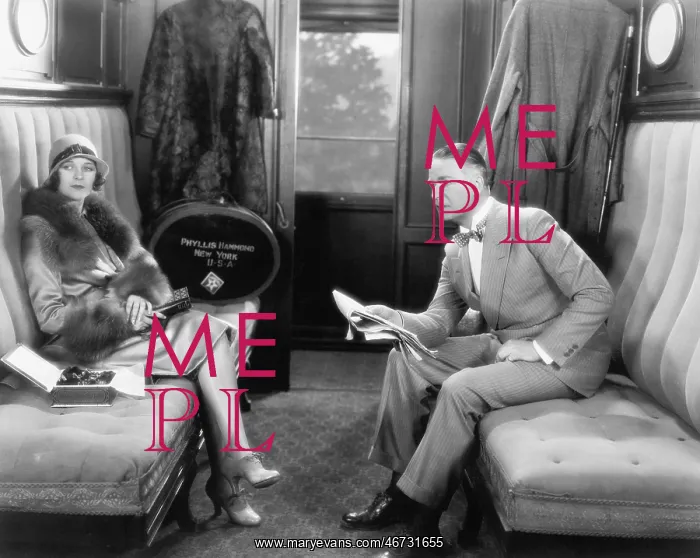  : Couple sitting together in a compartment of a train