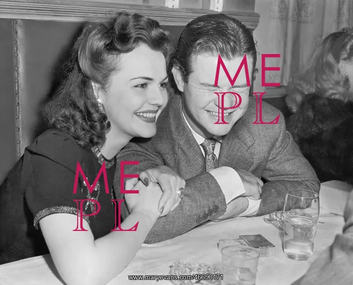 : Couple sitting together laughing and happy : Couple sitting together laughing and happy