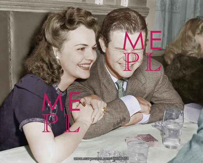 : Couple sitting together laughing and happy : Couple sitting together laughing and happy